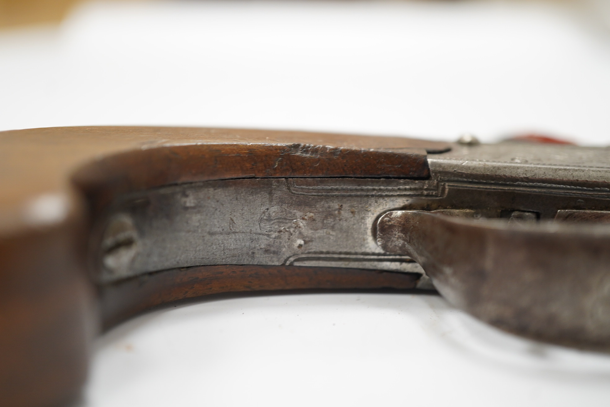 A cannon barrel flintlock boxlock travelling pistol by R. Daykin of Nottingham, with turn off cannon barrel, Tower private proof marks, signed frame upon foliate engraved background, slab walnut grip and sliding trigger